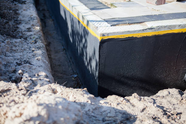 Professional Emergency Waterproofing technician working in Ionia, MI